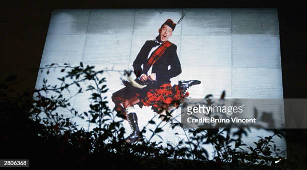 Artwork chosen by David Bailey including a giant image of designer Alexander McQueen in his kilt lights up the National Theatre as part of a number...