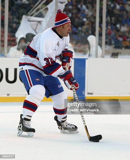 Claude Lemieux of the Montreal Canadiens looks to make a play against the Edmonton Oilers during the Molson Canadien Heritage Classic Megastars Game...