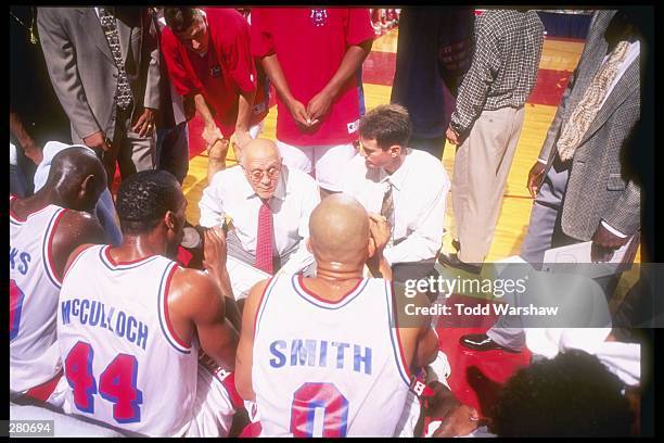 Fresno State Bulldogs head coach Jerry Tarkanian confers with his team during a game against the Weber State Wildcats at Selland Arena in Fresno,...