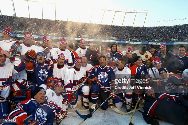 Members of the Montreal Canadiens and the Edmonton Oilers gather for a group photo after the Molson Canadien Heritage Classic Megastars Game on...