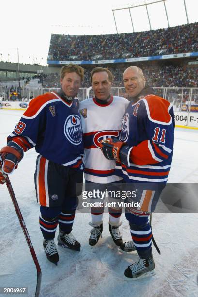 Wayne Gretzky and Mark Messier of the Edmonton Oilers pose for a photo with Guy Lafleur of the Montreal Canadiens after the Molson Canadien Heritage...