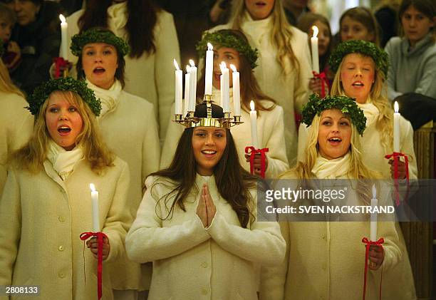 Stockholm's Lucia 2003, Therese Andersson and her maids sing Santa Lucia and Christmas songs at the NK department store in Stockholm 13 December 2003...