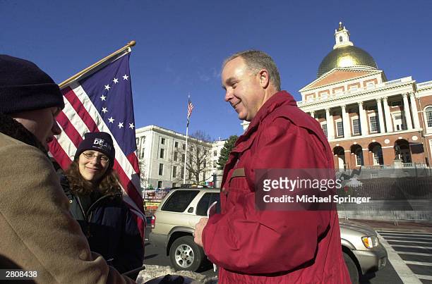 Bill Dean , brother of democratic presidential front-runner Howard Dean, visits with supporters of his brother at a rally in front of the...