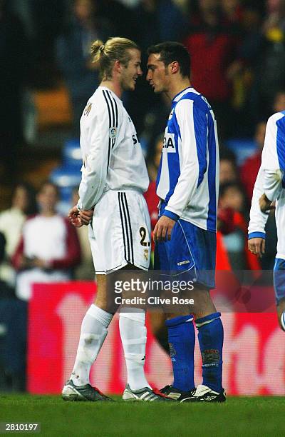 David Beckham of Real Mardid squares up to Scaloni of Deportivo during the Primera Liga match between Real Madrid and Deportivo La Coruna at the...