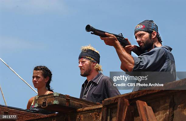 Contestants Darrah Johnson, Jon Dalton and Burton Roberts of the Balboa tribe during the immunity challenge "Musket Love,' 2003.