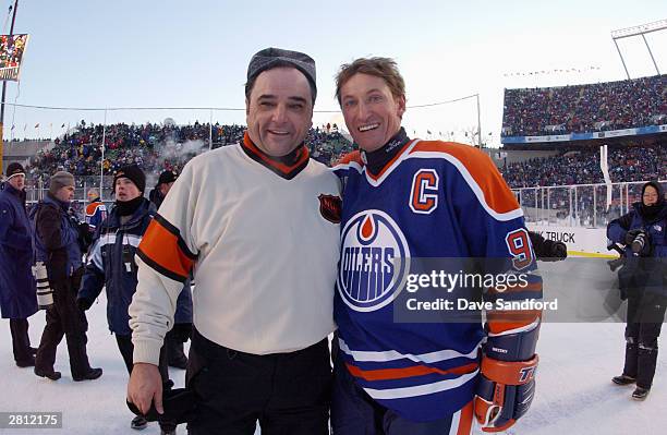 Wayne Gretzky of the Edmonton Oilers and referee Andy Van Hellemond pose for a photo during the Molson Canadien Heritage Classic on November 22, 2003...