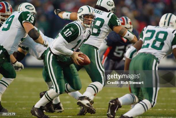 Quarterback Chad Pennington of the New York Jets looks to handoff to running back Curtis Martin during the game against the Buffalo Bills on December...