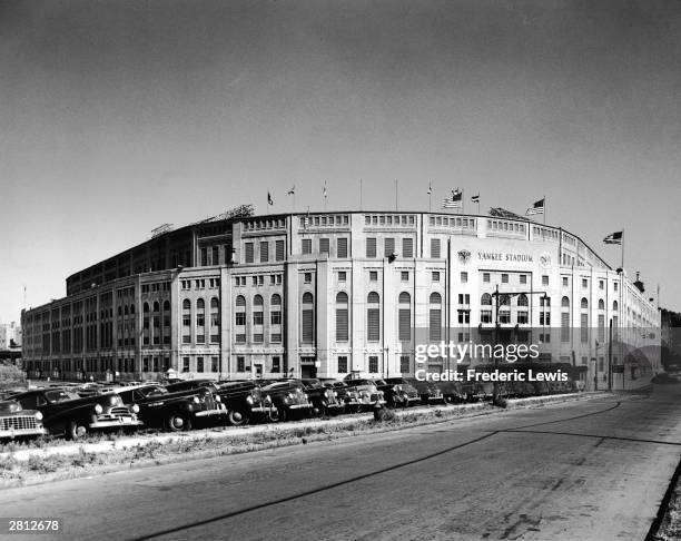 General view of Yankee Stadium and the parking lot in front filled to capacity, circa 1950.