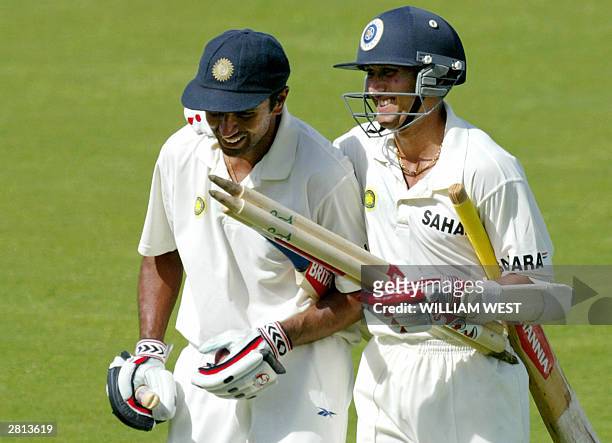 India batsman Rahul Dravid and teammate Agit Agarkar celebrate after defeating Australia as teammate Agit Agarkar collects the stumps on the final...