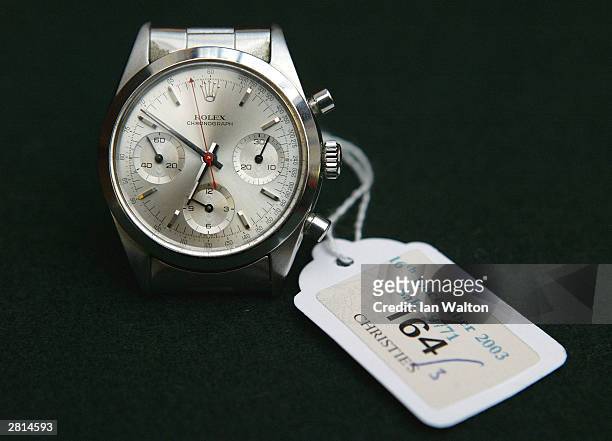 The Rolex wristwatch worn by George Lazenby during the film "On Her Majesty's Secret Service" is seen on display at an auction at Christie's auction...