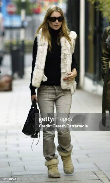 Model Kate Moss takes a walk on December 16, 2003 in West London.