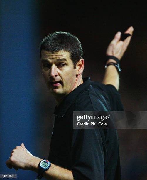 Referee Andy D'Urso signals during the FA Barclaycard Premiership match between Fulham and Bolton Wanderers on December 6, 2003 at Loftus Road in...