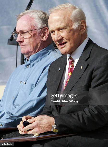 Former astronauts Neil Armstrong and Buzz Aldrin attend a presentation honoring 100 aviation heroes at the Wright Brothers Memorial December 16, 2003...