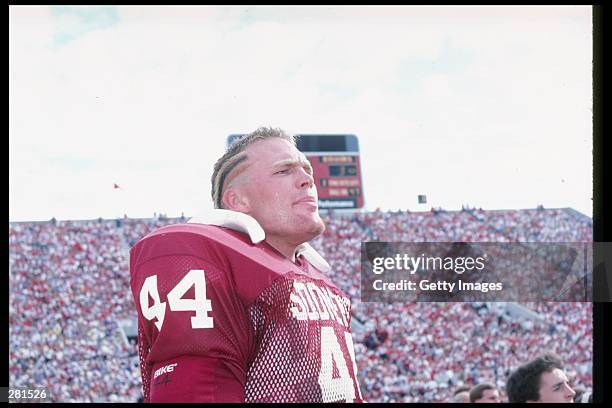 Defensive lineman Brian Bosworth of the Oklahoma Sooners stands on the sidelines during a game in Norman, Oklahoma.+Mandatory Credit: Allsport...