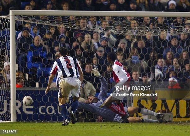 Kanu of Arsenal scores the opening goal during the Carling Cup Quarter Final match between West Bromwich Albion and Arsenal at The Hawthorns on...
