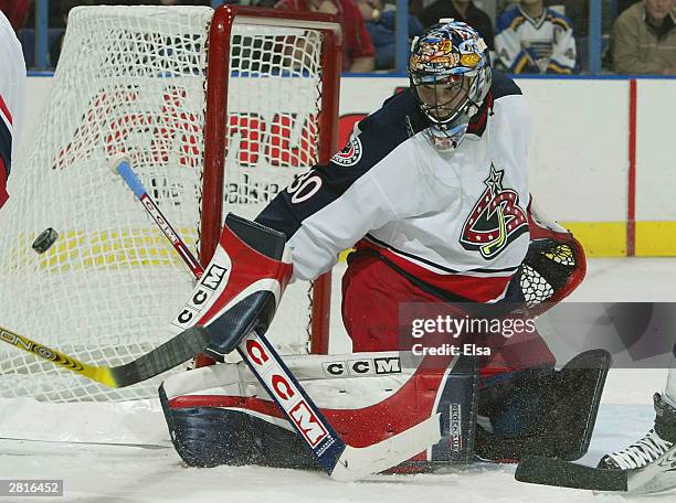 Marc Denis of the Columbus Blue Jackets makes a save in the third period against the St. Louis Blues December 16, 2003 at the Savvis Center in St....