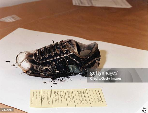 This undated handout photo shows the burnt remains of a shoe belonging to one of the two murdered ten year old girls that were found along with...