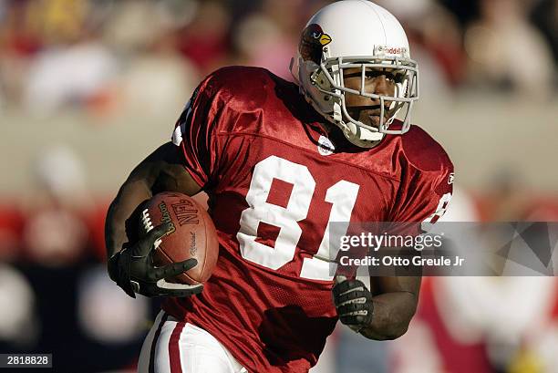 Wide receiver Anquan Boldin of the Arizona Cardinals runs after a catch during the game against the St. Louis Rams on November 23 2003 at Sun Devil...