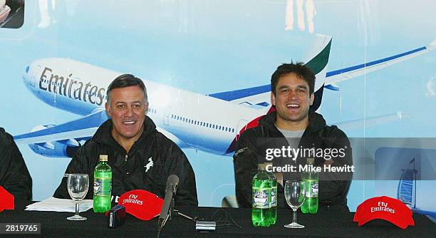 Coach Bryan Williams and captain Taine Randell laugh during a New Zealand Barbarians press conference at Dulwich College on December 18, 2003 in...