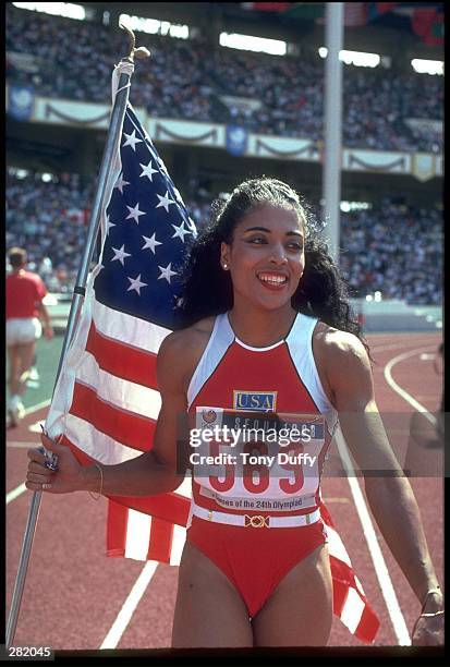 Griffith-Joyner of the USA after winning first in the women''s 100m at the Seoul Olympics in Seoul, Korea. Mandatory Credit: Tony Duffy/Allsport