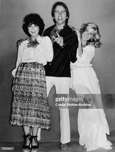 American actors Joyce DeWitt, John Ritter and Suzanne Somers in a full-length promotional portrait for the television series, 'Three's Company', 1979.