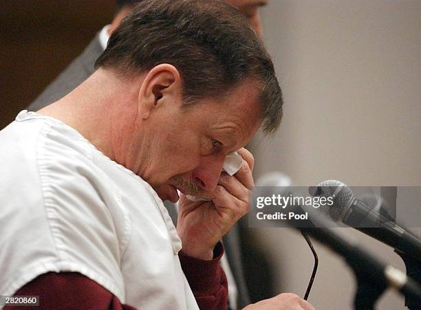 Green River Killer Gary Leon Ridgway cries as he reads a statement in a King County Washington Superior Court December 18, 2003 in Seattle. Ridgway...