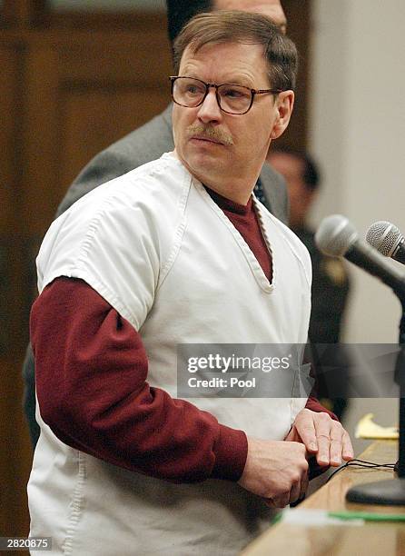 Green River Killer Gary Leon Ridgway cries as he reads a statement in a King County Washington Superior Court December 18, 2003 in Seattle. Ridgway...