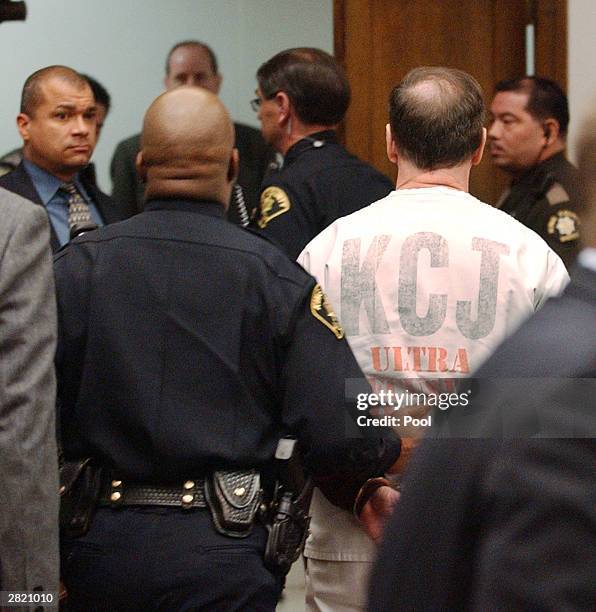 Green River Killer Gary Ridgway is led away from a King County Washington Superior courtroom December 18, 2003 in Seattle, Washington. Ridgway...