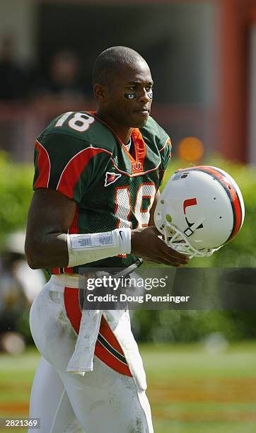 Quarterback Derrick Crudup of the University of Miami Hurricanes holds his helmet during the game against the Syracuse University Orangemen at the...