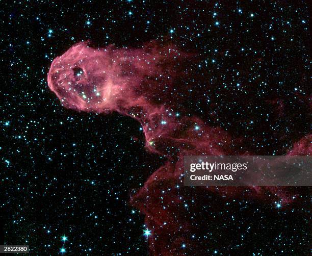 Resembling a flaming creature on the run, this image exposes the hidden interior of a dark and dusty cloud in the emission Nebula IC 1396. Young...