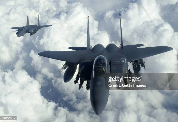 In this military handout photo F-15E Strike Eagles from Mountain Home Air Force Base, Idaho, soar over Iraq on December 18, 2003 in support of...
