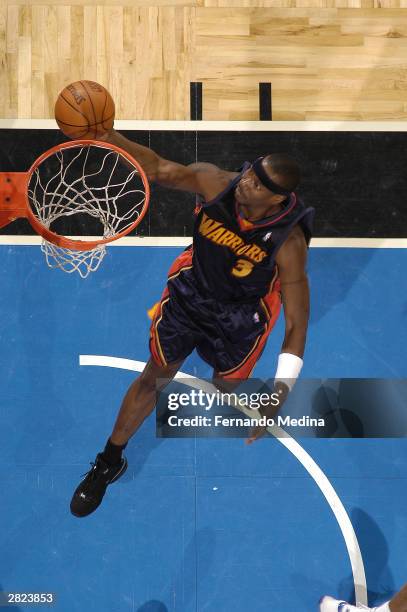 Cliff Robinson of the Golden State Warriors shoots against the Orlando Magic on December 19, 2003 at the TD Waterhouse Centre in Orlando, Florida....