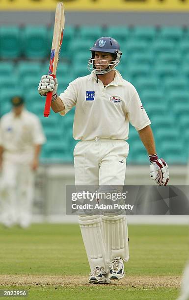 Michael Bevan of the Blues celebrates his fifty during the Pura Milk Cup Cricket match between the NSW Blues v Tasmanian Tigers at the SCG December...