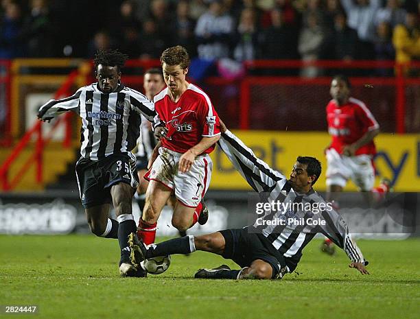 Scott Parker of Charlton gets tackled by Olivier Bernard and Nolberto Solano of Newcastle during the FA Barclaycard Premiership match between...