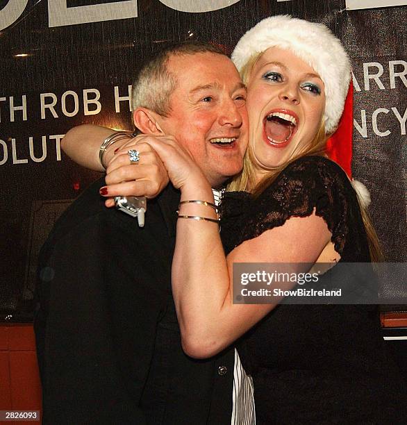 Music Manager, Louis Walsh and journalist Amanda Brunker arrive at Justin Timberlake's private concert in Vicar Street on December 20, 2003 in...