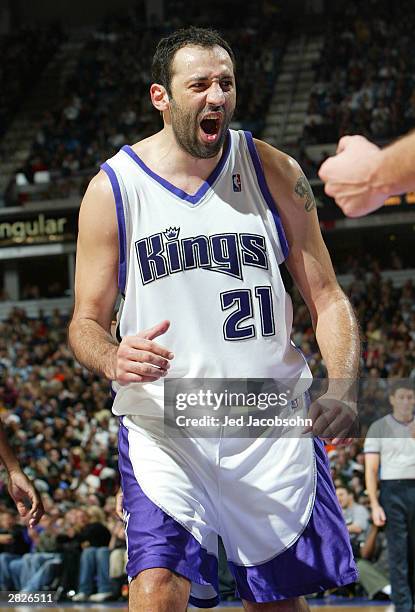 Vlade Divac of the Sacramento Kings celebrates against the Portland Trailblazers during an NBA game on December 21, 2003 at Arco Arena in Sacramento,...