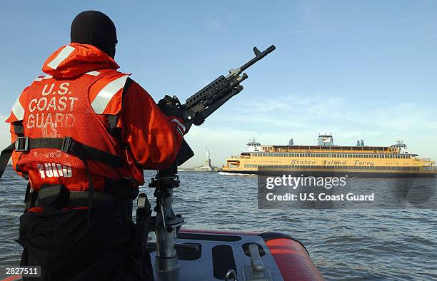 In this U.S. Coast Guard handout photo, U.S. Coast Guard Petty Officer 3rd Class Charles Carver from Houston, Texas patrols the New York harbor...