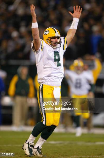 Brett Favre of the Green Bay Packers celebrates after throwing his fourh TD pass of the half against the Oakland Raiders during an NFL game on...