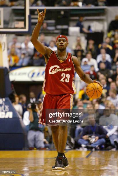 LeBron James of the Cleveland Cavaliers calls a play during the game against the Indiana Pacers at Conseco Fieldhouse on December 15, 2003 in...