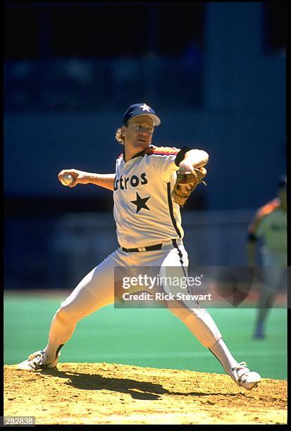 Pitcher Mike Scott of the Houston Astros throws a pitch from the pitchers mound.