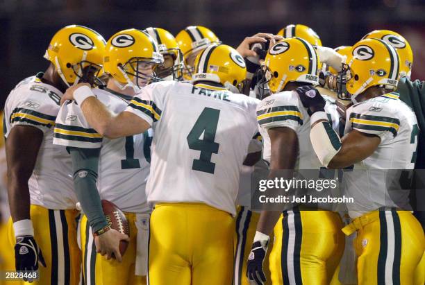 Brett Favre of the Green Bay Packers huddles with teammates prior to the Packers' game against the Oakland Raiders on December 22, 2003 at the...