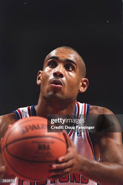 Guard Grant Hill of the Detroit Pistons prepares to shoot a free throw during the Pistons 107-91 win over the Sacramento Kings at The Palace in...