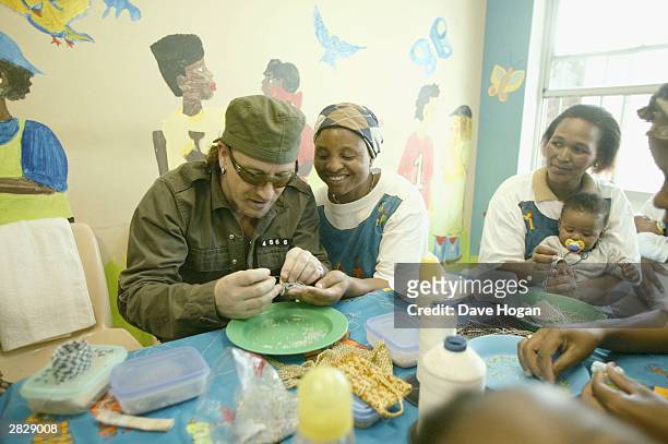 Singer Bono from U2 visit the Indawo Yokobelekisa Mothers 2 Mothers centre for young single mothers to have the opotunity to help each other on...