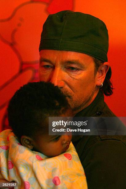 Singer Bono of U2 visits the Indawo Yokobelekisa Mothers 2 Mothers centre on December 5, 2003 in South Africa. The AIDS epidemic in South Africa...