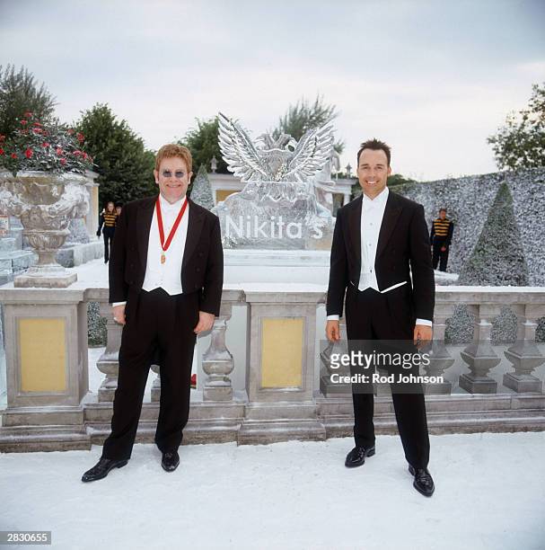 Singer Elton John and partner David Furnish attend The Fifth Annual White Tie And Tiara Ball that is held at the Elton John Residence, in Windsor,...