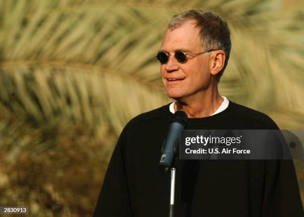 In this handout photo provided by the U.S. Air Force, "Late Show" television host David Letterman entertains soldiers at the Coalition Provisional...