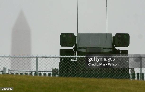An Avenger surface-to-air missile system is positioned on a hill as the Washington Monument rises in the background December 24, 2003 in Washington,...