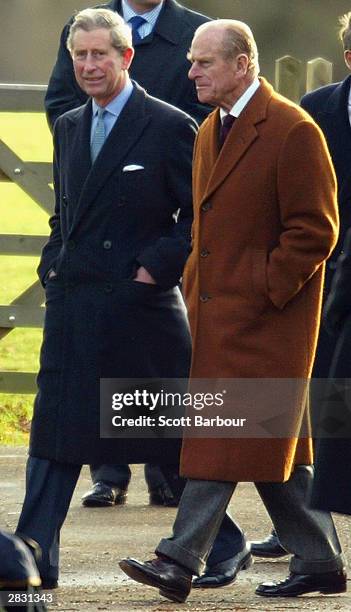 Prince Charles and Prince Philip the Duke of Edinburgh of the Royal family a Christmas Day service at Sandringham Church on December 25, 2003 in...