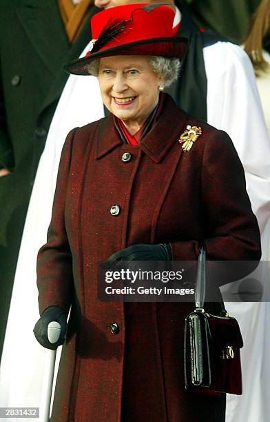 Her Majesty Queen Elizabeth II leaves along with other members of the Royal family after attending a Christmas Day service St. Mary Magdelene Church...