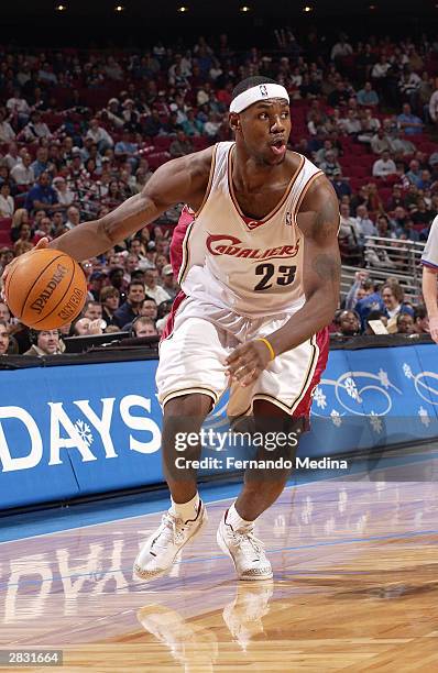 LeBron James of the Cleveland Cavaliers dribbles the ball against the Orlando Magic during NBA action December 25, 2003 at TD Waterhouse Centre in...